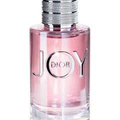 Dior JOY perfume bottle with pink liquid on a white background
