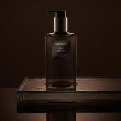 Tom Ford Oud Wood Hand and Body Wash on smoked glass