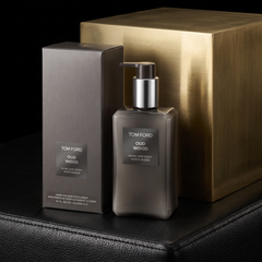 Tom Ford Oud Wood Hand and Body Moisturizer on black leather and brass