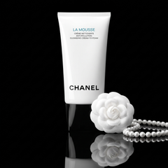 Chanel La Mousse Cleansing Cream-to-Foam in black and white with a camellia