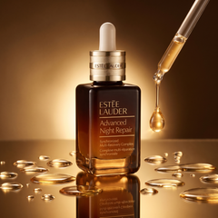 Estee Lauder Advanced Night Repair Serum with golden serum droplets