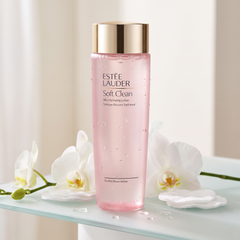 Estee Lauder Soft Clean Silky Hydrating Lotion with water droplets and cotton pads