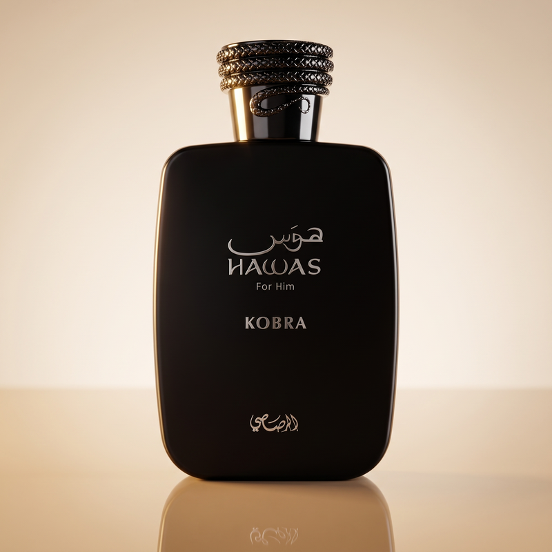 Rasasi Hawas Kobra 100ml black bottle on a warm sand-toned surface